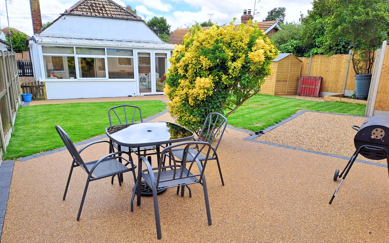 Level garden and patio beyond the conservatory