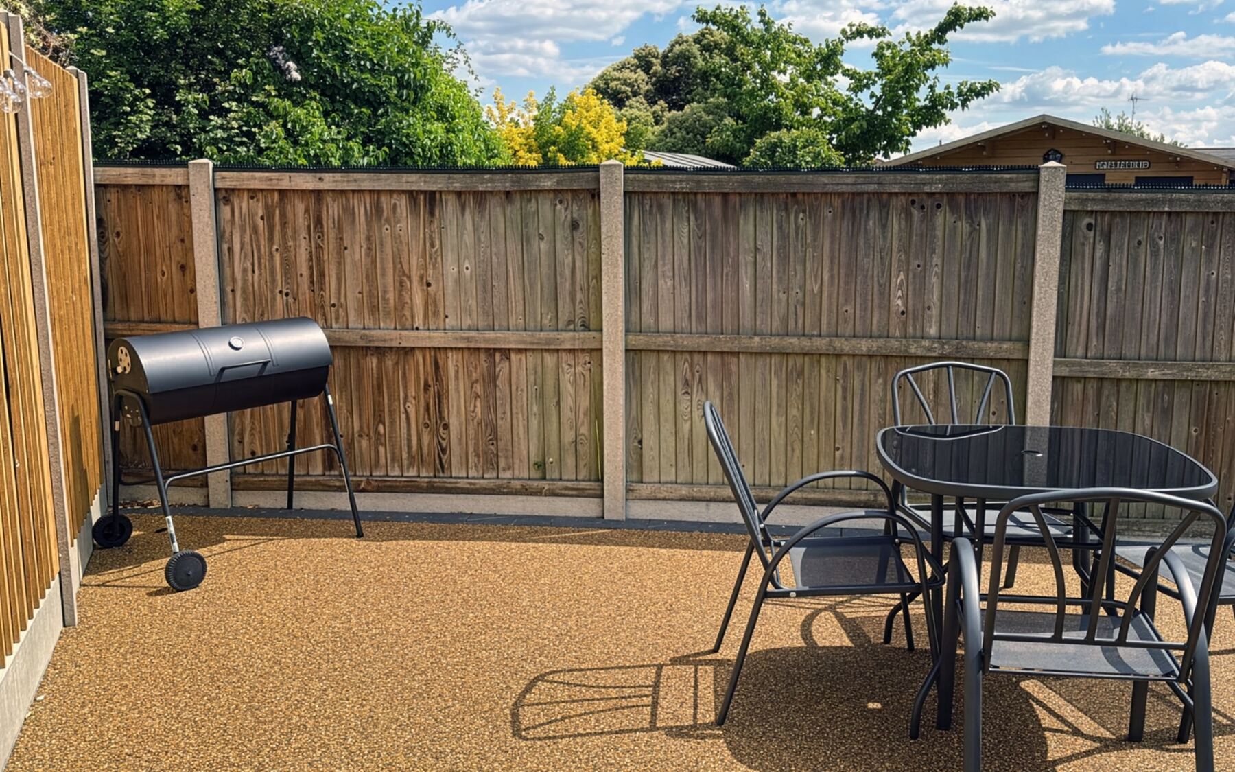 Level patio and enclosed dog-friendly garden