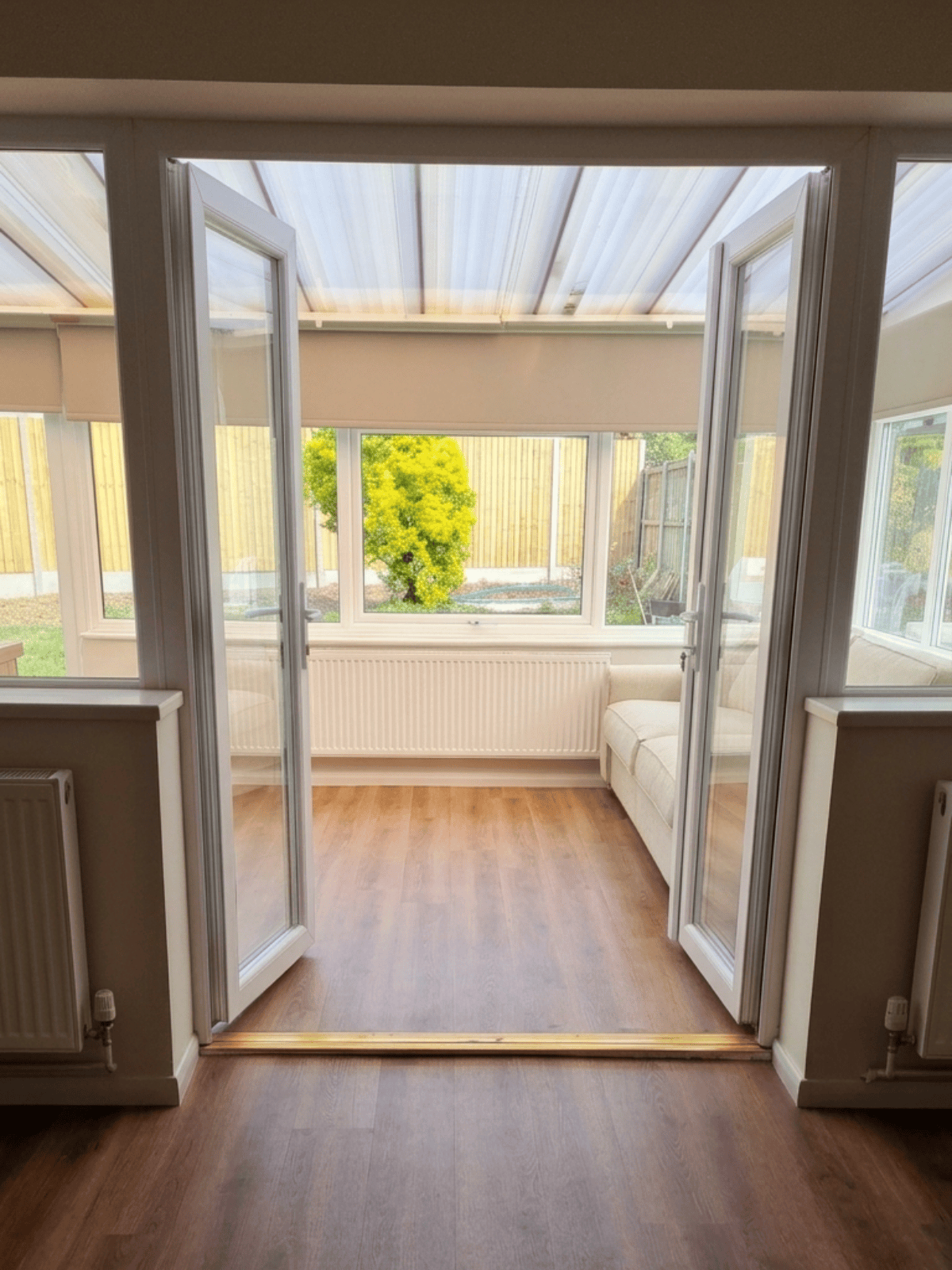 Conservatory doors opening toward the living space