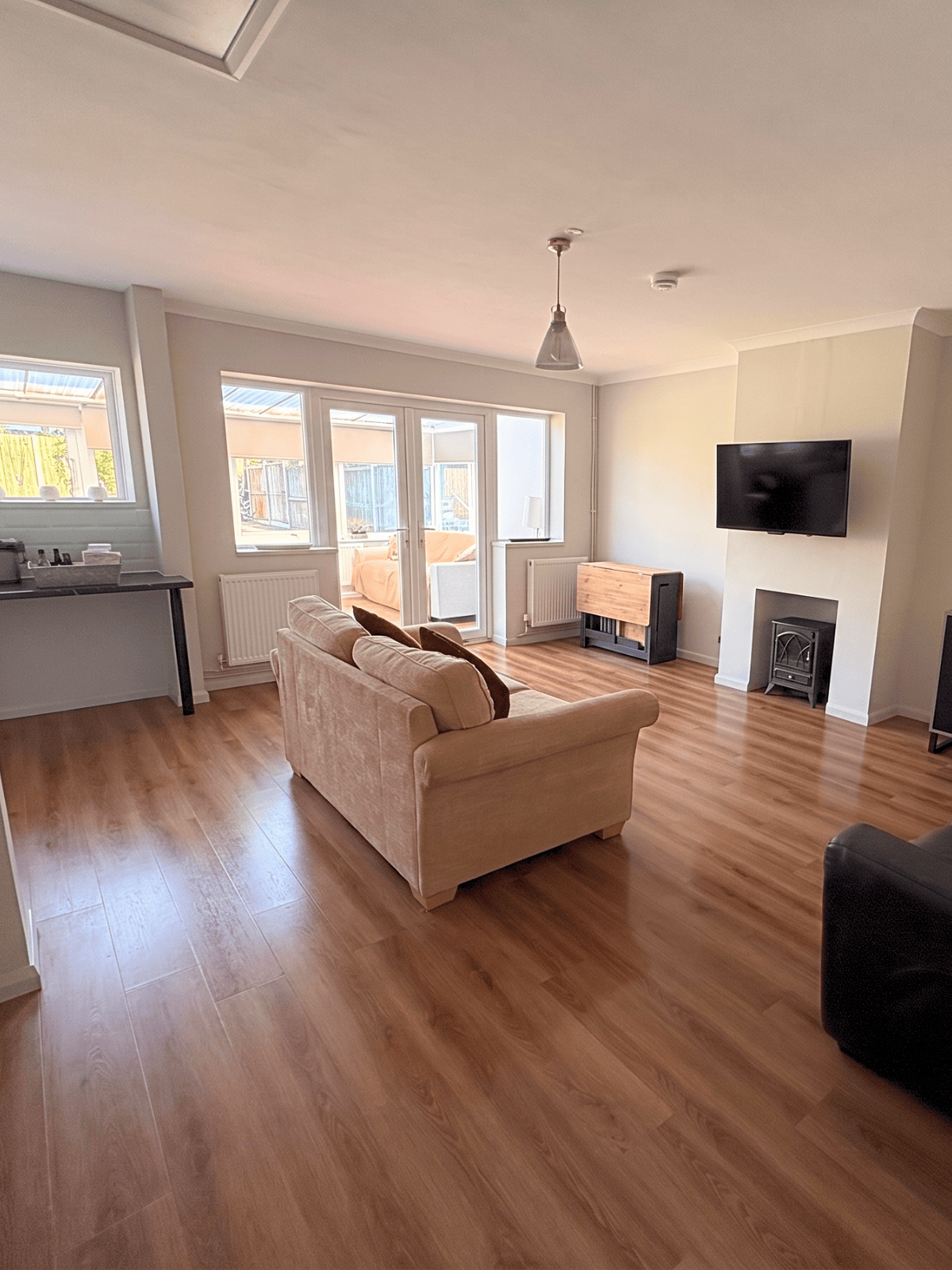 Open-plan living room with wide, step-free walkways between furniture