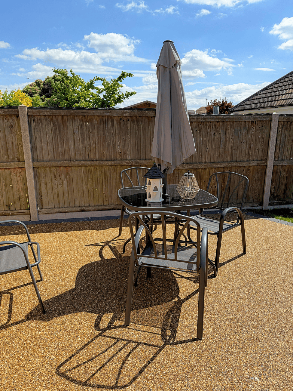 Level resin patio and seating area at Restwell